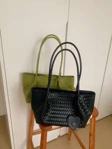 Woven leather shoulder tote bag with heart charm, large capacity casual handbag for daily use.