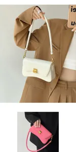 Close-up detail of the stylish women shoulder bag, elegant baguette design with metal clasp.