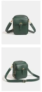 Dettaglio borsa a tracolla in pelle PU verde scuro, design compatto con accessori dorati.