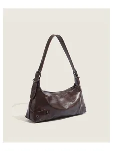 Retro brown leather underarm shoulder bag for women, vintage style rivet design chic and versatile.