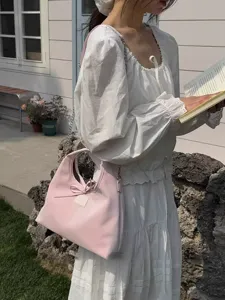 Korean minimalist casual women's messenger shoulder bag, sweet bow handle design.