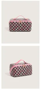 Detailed view of the colorful checkered makeup bag with pink handle and durable double zippers.