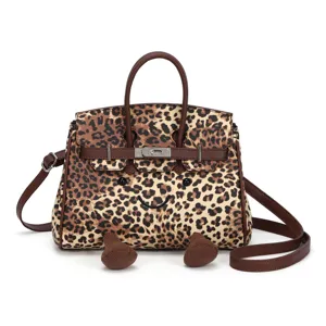 Niedliche Leo-Umhängetasche mit Cartoon-Gesicht, stylische Handtasche für Damen im Alltag.