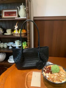 Black woven leather shoulder bag with heart pendant large capacity casual tote bag for women