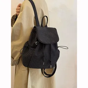 Casual plaid backpack for women, lightweight nylon school bag, versatile daily commuter daypack.