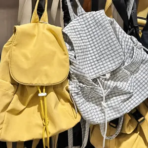 Casual nylon drawstring backpack, stylish plaid school bag for daily commuting and travel.