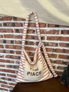Striped plush tote bag for women, cute embroidered casual shoulder bag detail view.