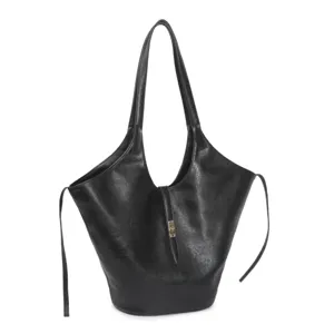 Black leather tote bag detail, featuring central strap clasp and slouchy winged side design.