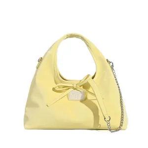 Korean style sweet yellow patent leather hobo bag with bow detail and chic chain strap.