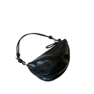 Black patent leather crescent underarm shoulder bag for women, stylish saddle bag style.