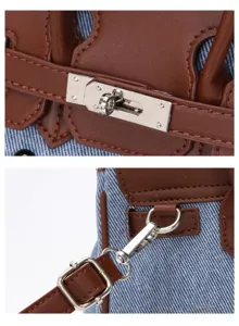 Denim Patchwork Handtasche Detail mit braunem Lederbesen und silbernem Metall Drehverschluss.