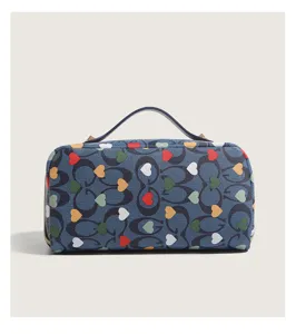 Large capacity cosmetic bag with stylish heart print and classic monogram pattern for travel.