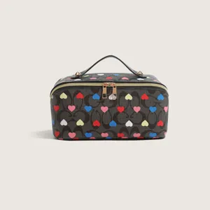 Stylish cosmetic bag with monogram print and colorful hearts, portable makeup travel pouch.