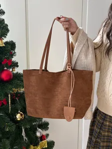 Detailed view of the brown suede tote bag, showcasing large capacity and soft texture.