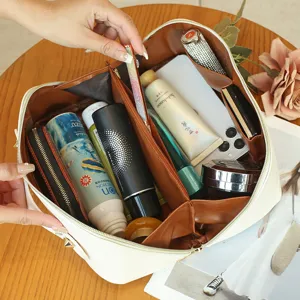 Large capacity travel cosmetic bag, portable multi-functional toiletry organizer shown open.