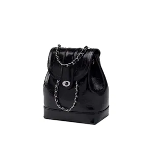 Black glossy leather backpack for women, stylish metal chain flap daypack for daily commuting.
