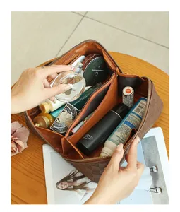 Brown checkered PU leather cosmetic bag with multi-compartments and waterproof travel bag.
