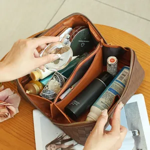 Brown checkered PU leather cosmetic bag with large capacity, waterproof travel storage organizer.