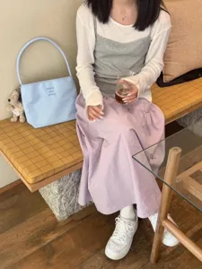 Korean niche nylon underarm bag with cute embroidery and trendy pendant for daily commute.