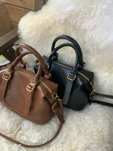 Retro PU leather bowling handbag stylish pillow shoulder messenger bag for women casual daily use.