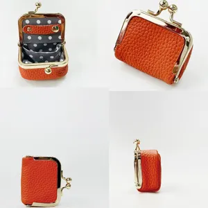 Mini leather kiss-lock coin purse jewelry box, cute portable orange pouch for rings and small items.