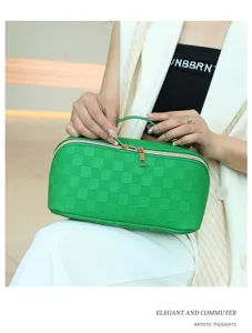 Green PU leather cosmetic bag with chic grid pattern, gold zipper and top handle.