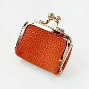 Mini orange leather kiss-lock coin purse cute vintage jewelry storage pouch for women.