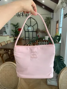 Pink nylon underarm bag with cute embroidery, casual shoulder handbag for women daily commute.
