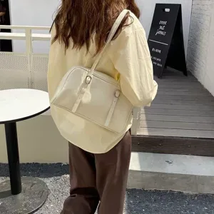 Casual minimalist shoulder bag for women, Korean style chic PU leather underarm daily commuting bag.