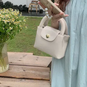 Korean style heart lock handbag for women, chic PU leather shoulder crossbody bag.