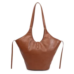 Brown leather tote bag detail, large capacity slouchy shoulder bag for daily commuting work use.