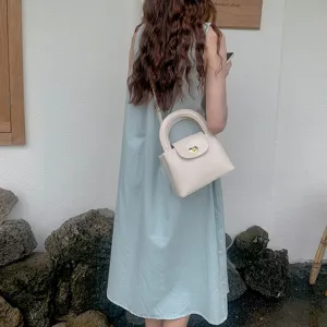 Chic beige heart lock handbag, stylish single shoulder crossbody bag for women daily fashion use.
