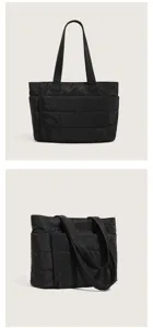 Black quilted tote bag detailed view, lightweight multi-compartment casual shoulder bag.