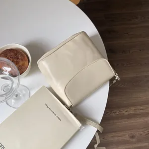 Minimalist beige crossbody bag with flap, perfect for daily commuting and chic casual styling.