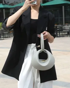 Elegant crescent handbag for women, unique ring handle underarm bag, chic leather commuting purse.