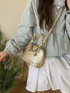 Chic Metallic Shell Crossbody Bag with Rivets and Dice Chain for Stylish Women