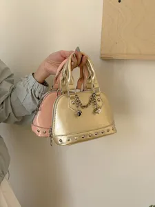 Stylish women patent leather shell handbag featuring metal chain and studs for daily chic outfit