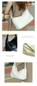 Close-up details of the soft faux leather slouchy shoulder bag, wide strap and secure zip.