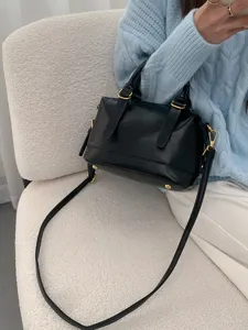 Black vintage bowling handbag detail, stylish shoulder strap and premium leather look for commute.