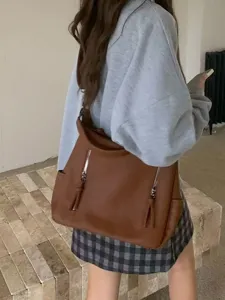 Retro brown leather tote bag with double front zippers and large capacity for daily commute.