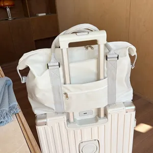 Large capacity travel duffel bag with luggage sleeve in minimalist white style for women short trips