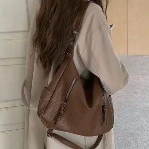 Vintage brown leather hobo tote bag, stylish large capacity commuter crossbody bag for women.