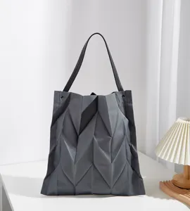 Detailed view of the stylish grey geometric pleated canvas tote bag for daily commute.