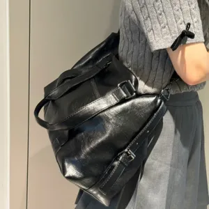 Black vintage soft leather tote bag for women, large capacity casual shoulder and travel bag.