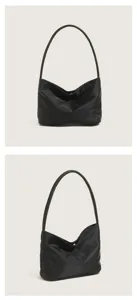 Minimalist black nylon underarm shoulder bag for women, casual commuter handbag with embroidery.