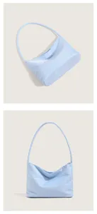 Light blue nylon shoulder bag detail, stylish hobo underarm purse, minimalist design.