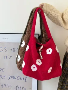 Detail shot of winter plush flower embroidered tote bag, minimalist aesthetic canvas bucket bag.