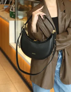 Black crescent hobo shoulder bag for women, stylish PU leather crossbody purse with gold hardware.