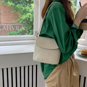 Elegant white shoulder bag lifestyle detail shot showcasing clean minimalist design and finish.