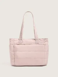 Minimalist pink quilted tote bag, lightweight padded shoulder handbag for women daily use.